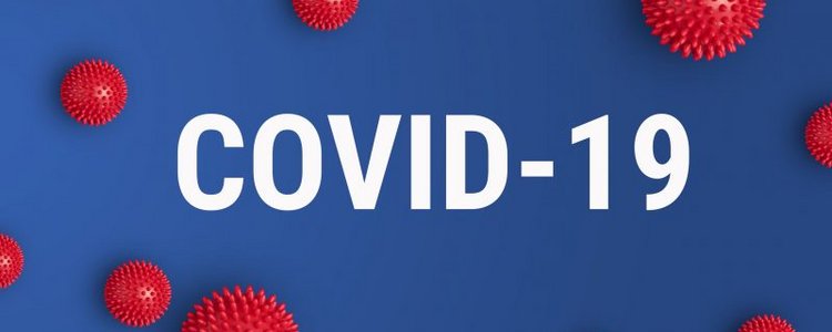 Grafische Darstellung von Viren. COVID-19 steht in der Mitte des Bildes geschrieben